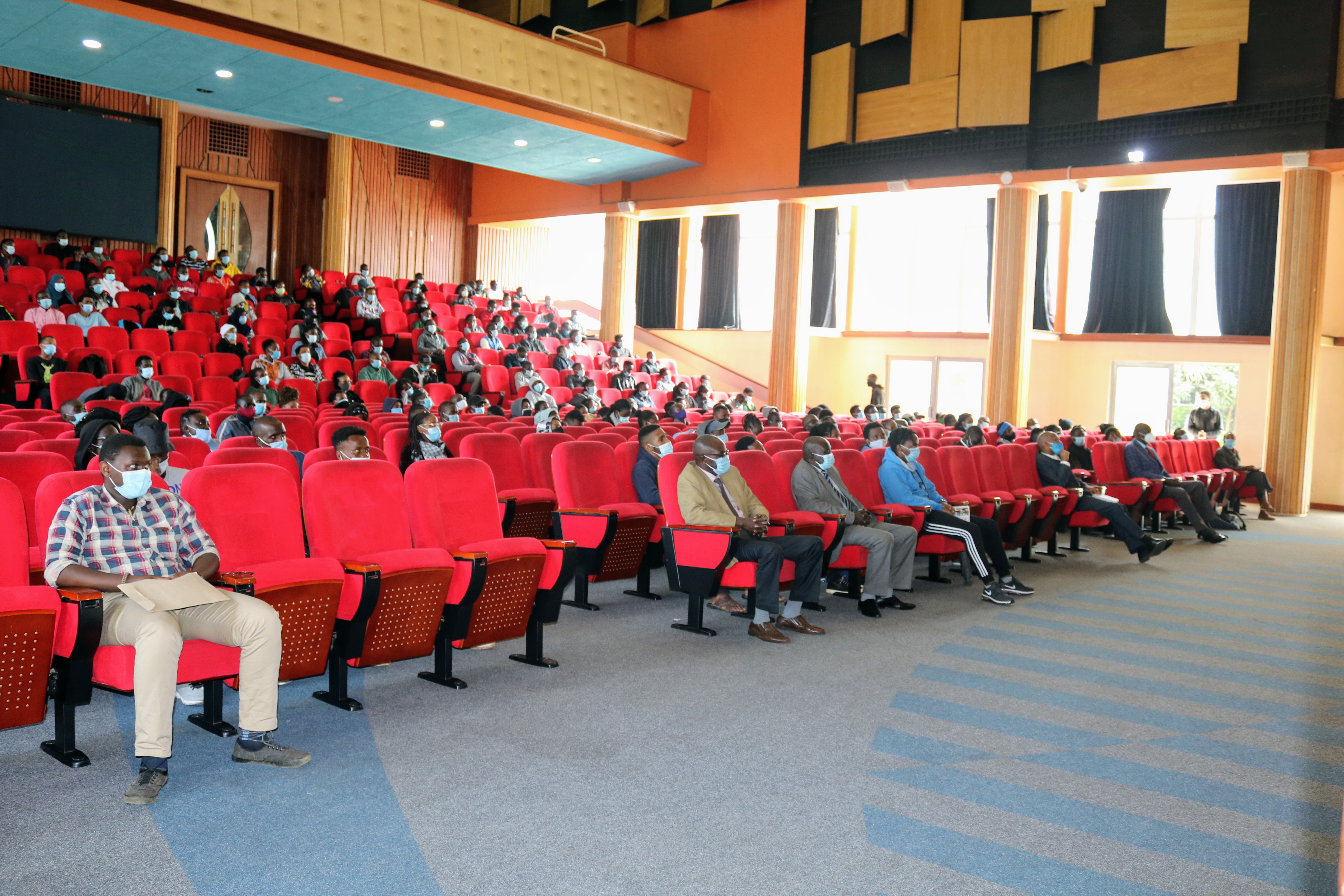 Students listen to the principals address.