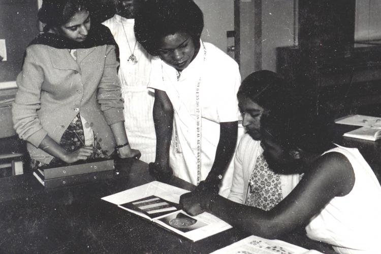 Dr. Julia Ojiambo (now a professor and the Chair of Council) takes students through a practical session in the 1980s